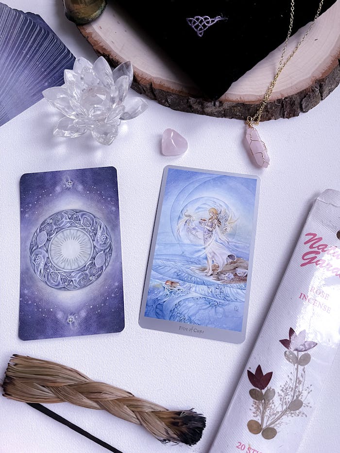 why-choose-us Intimate tarot card reading setup featuring crystals and incense for spiritual exploration.